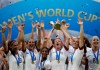 FILE - In this July 7, 2019, file photo, United States' Megan Rapinoe lifts up a trophy after winning the Women's World Cup final soccer match between US and The Netherlands at the Stade de Lyon in Decines, outside Lyon, France. The global players' association released its report on the state of women's soccer, after warning that the coronavirus outbreak could have a disastrous impact following the gains of last summer's Women's World Cup. (AP Photo/Alessandra Tarantino, File)