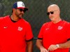 FILE - In this Feb. 17, 2020, file photo, Washington Nationals manager Dave Martinez, left, talks with general manager Mike Rizzo during spring training baseball practice in West Palm Beach, Fla. Nationals general manager Mike Rizzo says his top offseason priority is adding a middle-of-the-order hitter. (AP Photo/Jeff Roberson, File)