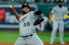 FILE - In this Friday, July 31, 2020 file photo, Chicago White Sox relief pitcher Alex Colome throws during the ninth inning of a baseball game against the Kansas City Royals in Kansas City, Mo. The Minnesota Twins are bringing back designated hitter Nelson Cruz and adding right-hander Alex ColomÃ©, Wednesday, Feb. 3, 2021. (AP Photo/Charlie Riedel)