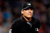 FILE - In this Sept. 3, 2018, file photo, umpire Angel Hernandez (5) is seen in the first inning during a game between the Arizona Diamondbacks the San Diego Padres, in Phoenix. Umpire Ángel Hernández lost his lawsuit against Major League Baseball alleging racial discrimination. The Cuba-born Hernández sued in 2017 in U.S. District Court in Cincinnati, a case later moved to New York. Hired as a big league umpire in 1993, he alleged he was discriminated against because he had not been assigned to the World Series since 2005 and had been passed over for crew chief. (AP Photo/Rick Scuteri, File)