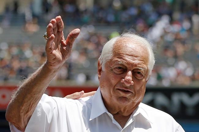 FILE - Hall of Fame manager Tommy Lasorda waves to the crowd before a baseball game at Yankee Stadium in New York, in this June 10, 2015, file photo. Tommy Lasorda, the fiery Hall of Fame manager who guided the Los Angeles Dodgers to two World Series titles and later became an ambassador for the sport he loved during his 71 years with the franchise, has died. He was 93. The Dodgers said Friday, Jan. 8, 2021, that he had a heart attack at his home in Fullerton, California. (AP Photo/Kathy Willens, File)