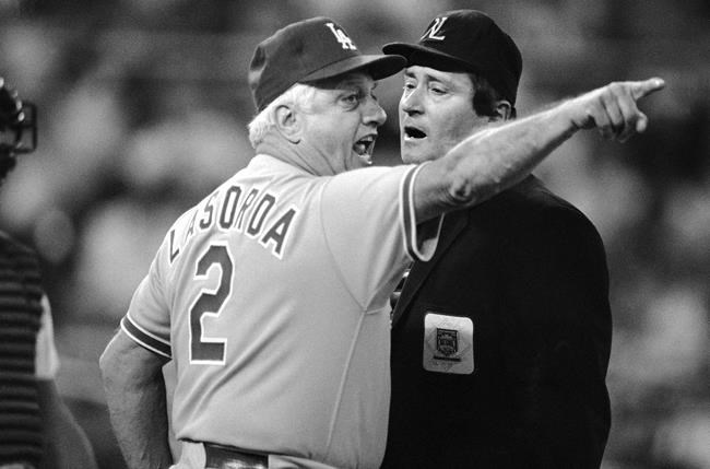 FILE - Los Angeles Dodgers manager Tommy Lasorda, left, argues with home plate umpire Fred Brocklander during the second inning of a National League baseball game against the Philadelphia Phillies in Philadelphia, in this Saturday, Sept. 6, 1986, file photo. Lasorda, the fiery Hall of Fame manager who guided the Los Angeles Dodgers to two World Series titles and later became an ambassador for the sport he loved during his 71 years with the franchise, has died. He was 93. The Dodgers said Friday, Jan. 8, 2021, that he had a heart attack at his home in Fullerton, California. Resuscitation attempts were made on the way to a hospital, where he was pronounced dead shortly before 11 p.m. Thursday. (AP Photo/Charles Krupa, File)