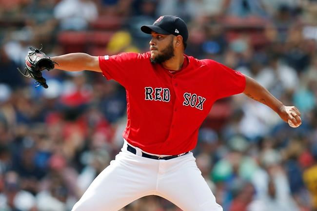 FILE - In this July 27, 2019, file photo, Boston Red Sox's Eduardo Rodriguez pitches during the first inning of a baseball game against the New York Yankees in Boston. (AP Photo/Michael Dwyer, File)