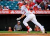 FILE - In this July 27, 2019, file photo, Los Angeles Angels' Mike Trout runs to first while watching his two-run home run during the first inning of the team's baseball game against the Baltimore Orioles in Anaheim, Calif. (AP Photo/Mark J. Terrill, File)