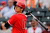 FILE - In this Feb. 28, 2020, file photo, Los Angeles Angels' Shohei Ohtani bats during the first inning of a spring training baseball game against the Texas Rangers, in Tempe, Ariz. (AP Photo/Charlie Riedel, File)