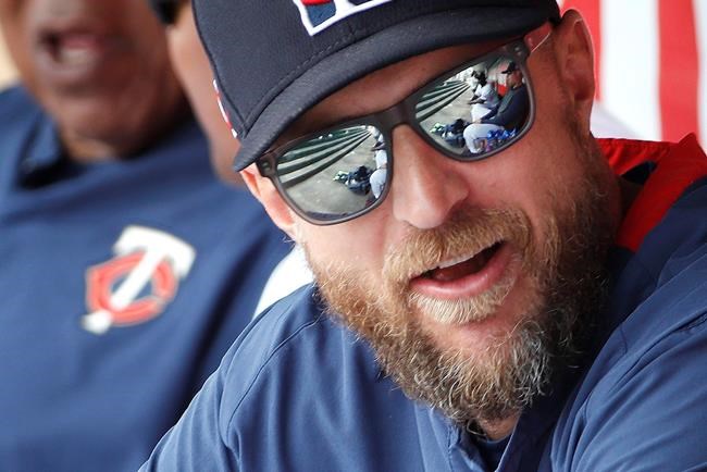 FILE - In this Monday, March 9, 2020, file photo, Minnesota Twins manager Rocco Baldelli speaks to players in the dugout before a spring training baseball game against the St. Louis Cardinals, in Fort Myers, Fla. (AP Photo/Elise Amendola, File)
