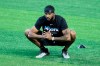 FILE - In this July 3, 2020, file photo, Miami Marlins starting pitcher Sandy Alcantara stretches during a baseball workout at Marlins Park in Miami. (AP Photo/Lynne Sladky, File)