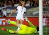 FILE - In this Aug. 3, 2019, file photo, United States midfielder Lindsey Horan, top, scores against Ireland goalkeeper Marie Hourihan during the first half of an international friendly soccer match in Pasadena, Calif. Horan described herself as miserable when she caught COVID-19 late last year. The 26-year-old midfielder was set to accompany the U.S. national team to the Netherlands for their final match of the year when U.S. Soccer announced her diagnosis on Nov. 18. (AP Photo/Alex Gallardo, File)