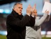 FILE - In this March 24, 2018, file photo, Sporting Kansas City's Peter Vermes acknowledges fans as he takes the pitch to lead his team against the Colorado Rapids in an MLS soccer match in Commerce City, Colo. Major League Soccer coaches are welcoming the opportunity to use five substitutes when play resumes in Florida next month, out of concern for both player fitness and the summertime heat. The adoption of the rule and the expansion of game-day rosters are especially important given the relatively short preparation time teams have had for the MLS Is Back Tournament, which starts July 8, 2020, at the sports complex at Walt Disney World. (AP Photo/David Zalubowski, File)