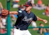 FILE - In this March 4, 2019, file photo, Atlanta Braves' Grant Dayton pitches against the Houston Astros in the sixth inning of a spring baseball exhibition game in Kissimmee, Fla. Dayton is excited to driving north for the resumption of spring training with the Braves. He knows he will not be getting any more salary. 