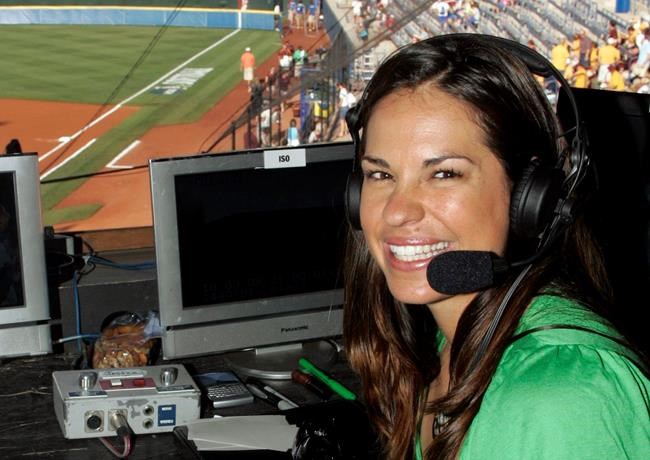 FILE - In this May 29, 2009, file photo, USA softball player Jessica Mendoza poses for a photo in the ESPN broadcast booth at the Women's College World Series in Oklahoma City. The dual roles of former Boston pitcher Pedro Martinez and Mendoza as team employees and broadcasters have drawn the concern of baseball Commissioner Rob Manfred. (AP Photo/File)