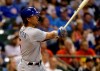 FILE - In this July 27, 2019, file photo, Chicago Cubs' Albert Almora Jr. watches his home run against the Milwaukee Brewers during the tenth inning of a baseball game in Milwaukee. Almora has agreed to a contract with the New York Mets, a person familiar with the deal told The Associated Press. The person spoke to the AP on condition of anonymity Sunday, Feb. 7, 2021, because the agreement was subject to a successful physical. (AP Photo/Jeffrey Phelps, File)