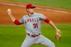 FILE - In this Sept. 10, 2020, file photo, Los Angeles Angels relief pitcher Ty Buttrey throws to a Texas Rangers batter during the ninth inning of a baseball game in Arlington, Texas. Buttrey has retired from baseball, saying he has lost his affection for the game. (AP Photo/Tony Gutierrez, File)