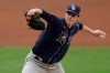 FILE - In this Oct. 8, 2020, file photo, Tampa Bay Rays relief pitcher Ryan Yarbrough throws against the New York Yankees during the fourth inning in Game 4 of a baseball American League Division Series in San Diego. St. Louis pitcher Jack Flaherty and Atlanta pitcher Mike Soroka won their salary arbitration cases on Saturday, Feb. 13, 2021, and Yarbrough lost. (AP Photo/Jae C. Hong, File)