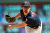 FILE - In this Aug. 4, 2019, file photo, Minnesota Twins pitcher Devin Smeltzer watches a pitch against the Kansas City Royals in the sixth inning of a baseball game in Minneapolis. The Twins remain publicly confident in the rotation anchored by returning veterans Jose Berrios and Jake Odorizzi and supplemented by youngsters like Smeltzer, Randy Dobnak and Lewis Thorpe. (AP Photo/Jim Mone, File)