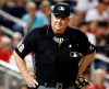 FILE - In this Sept. 27, 2019, file photo, umpire Joe West stands on the field during a baseball game between the Cleveland Indians and the Washington Nationals in Washington. Major league umpire West was awarded $500,000 in damages plus interest dating to July 8 in a defamation suit against former All-Star catcher Paul Lo Duca. (AP Photo/Patrick Semansky, File)