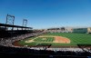 FILE - In this March 18, 2016, file photo, fans at Salt River Fields at Talking Stick watch a spring training baseball game between the Arizona Diamondbacks and the Los Angeles Dodgers in Scottsdale, Ariz. The Diamondbacks sold out their entire spring allotment of tickets in less than 24 hours after they went on sale to the public. Approximately 2,200 tickets were sold for all 14 of the team's home games, with fans spread throughout the park in pods of two, four or six seats and masks are required except when eating or drinking. (AP Photo/Jeff Chiu, File)