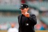 FILE - In this Sept. 1, 2019, file photo, home plate umpire Angel Hernandez signals during the fifth inning of a baseball game between the Detroit Tigers and the Minnesota Twins in Detroit. A major league official testified he suggested Hernandez be removed from consideration for the 2015 World Series because he did not think Commissioner Rob Manfred would approve the umpire to work baseball’s premier event. Hernandez sued Major League Baseball in 2017, alleging race discrimination and cited his failure to be assigned to the World Series since 2005 and MLB's failure to promote him to crew chief. (AP Photo/Carlos Osorio, File)