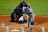 FILE - In this Oct. 24, 2020, file photo, Los Angeles Dodgers' Justin Turner hits a home run against the Tampa Bay Rays during the first inning in Game 4 of the baseball World Series in Arlington, Texas. Turner is returning to the Dodgers, announcing via Twitter that he’s ready to “run it back” with the World Series champions. (AP Photo/Sue Ogrocki, File)