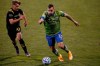 FILE - In this Dec. 12, 2020, file photo, Seattle Sounders' Jordan Morris, right, tries to advance the ball past Columbus Crew's Aidan Morris during the second half of the MLS Cup championship game in Columbus, Ohio. Players from the U.S. soccer team are considering what they can do to set a positive example for a shaken country. The team gathered last week in Bradenton, Fla., a day after a deadly riot in the Capitol by a pro-Trump mob. Morris says last week's events were ‚Äúhorrific‚Äù and showed ‚Äúa need for change in this country.‚Äù (AP Photo/Jay LaPrete, File)