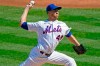 FILE - In this Sept. 6, 2020, file photo, New York Mets starting pitcher Jacob deGrom winds up during the second inning of a baseball game against the Philadelphia Phillies in New York. Mets ace deGrom is going for his third consecutive NL Cy Young Award, and Los Angeles Dodgers outfielder Mookie Betts could become the second player to win the MVP award in each league. (AP Photo/Kathy Willens, File)