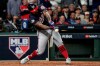 FILE - In this Oct. 30, 2019, file photo, Washington Nationals' Howie Kendrick hits a two-run home run during the seventh inning of Game 7 of the baseball World Series against the Houston Astros in Houston. Major League Baseball has proposed expanding the playoff field from 10 teams to as many as 16 for this year and next season. Other major sports are accustomed to more teams in the postseason. (AP Photo/David J. Phillip, File)