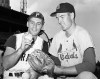 FILE - In this Aug. 11, 1960, file photo, shortstop Dick Groat, left, of the Pittsburgh Pirates, and pitcher Lindy McDaniel, of the St. Louis Cardinals, talk at Forbes Field in Pittsburgh. McDaniel, an All-Star reliever who appeared in nearly 1,000 major league games over 21 seasons, has died. He was 84. (AP Photo/File)