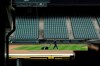 A grounds crew worker cuts the infield in front of empty seats at T-Mobile Park in Seattle, March 26, 2020, around the time when the first pitch would have been thrown in the Mariners' Opening Day baseball game against the visiting Texas Rangers. (AP Photo/Ted S. Warren)