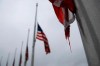 FILE - In this May 22, 2020, file photo, a raindrop falls from an American flag at half-staff at the Washington Monument, in Washington. President Donald Trump ordered American flags to be flown at half-staff for a three day period in remembrance of Americans who have lost their lives due to the coronavirus outbreak. (AP Photo/Patrick Semansky, File)