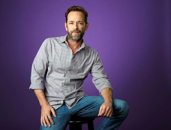 FILE - In this Aug. 6, 2018, file photo, Luke Perry poses for a portrait during the 2018 Television Critics Association Summer Press Tour in Beverly Hills, Calif. A publicist for Perry says the