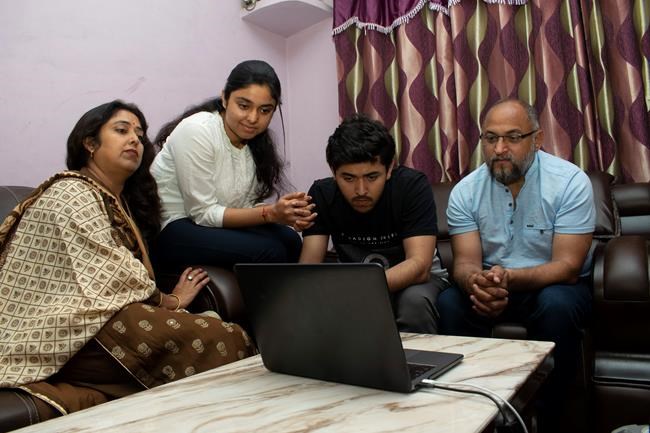 Associated Press photographer Channi Anand watches the announcement of the Pulitzer Prizes via video conferencing from his home in Jammu, India, Tuesday, April 5, 2020. Anand was one of three AP photographers who won the Pulitzer Prize in Feature Photography for their coverage of the conflict in Kashmir and in Jammu, India. (AP Photo)