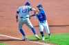 Toronto Blue Jays shortstop Santiago Espinal, right, tags New York Mets' Todd Frazier for an out on a rundown during the first inning of a baseball game in Buffalo, N.Y., Sunday, Sept. 13, 2020. (AP Photo/Adrian Kraus)