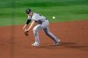 New York Yankees third baseman Gio Urshela fields a ground ball by Toronto Blue Jays' Teoscar Hernandez before throwing home during the fourth inning of a baseball game in Buffalo, N.Y., Monday, Sept. 21, 2020. Jonathan Davis was safe at home and Hernandez was safe at first. (AP Photo/Adrian Kraus)