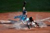 Toronto Blue Jays catcher Danny Jansen, left, tags out Baltimore Orioles' Mason Williams at home plate during the 10th inning of a baseball game in Buffalo, N.Y., Monday, Aug. 31, 2020. (AP Photo/Adrian Kraus)