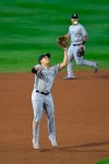 New York Yankees third baseman Gio Urshela fields a ball hit by Toronto Blue Jays' Vladimir Guerrero Jr. and forces out Teoscar Hernández at third during the sixth inning of a baseball game in Buffalo, N.Y., Wednesday, Sept. 23, 2020. Guerrero Jr. was safe at first. (AP Photo/Adrian Kraus)