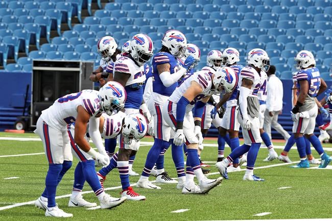 The Buffalo Bills stretch in pregame warmups during the ninth day of NFL football training camp at Bills Stadium in Orchard Park, N.Y., Thursday, Aug. 27, 2020. (James P. McCoy/Buffalo News via AP, Pool)