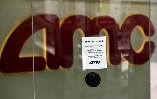 FILE - In this April 29, 2020 file photo, a message on the ticket window at the AMC Burbank 16 movie theaters complex informs potential customers that it is currently closed in Burbank, Calif. AMC says its business is suffering because of the coronavirus pandemic and it may not survive. All of the company’s theaters are shut down through June, and while the theaters are closed the company is generating no revenue. (AP Photo/Chris Pizzello, File)