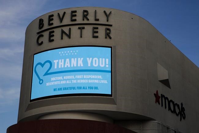 FILE - In this May 6, 2020 file photo, an electronic banner thanks