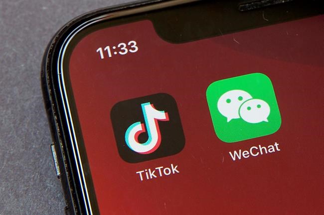 An Australian Senate committee has recommended a ban on the Chinese-owned video-sharing app TikTok from federal government devices be extended to China’s most popular social media platform, WeChat. (AP Photo/Mark Schiefelbein, File)