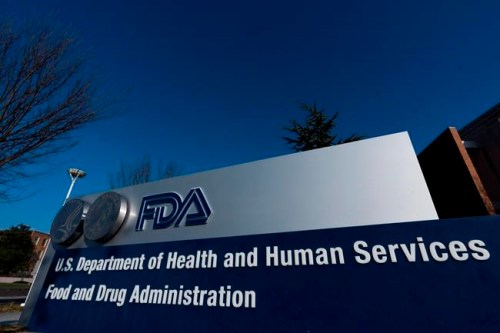 FILE - This Dec. 10, 2020 file photo shows Food and Drug Administration building in Silver Spring, Md. Each year the U.S. approves dozens of new uses for cancer drugs based on early signs that they can shrink or slow the spread of tumors. But how often do patients actually live longer, more active lives? That seemingly simple question is, in fact, one of the thorniest debates in medicine. (AP Photo/Manuel Balce Ceneta)