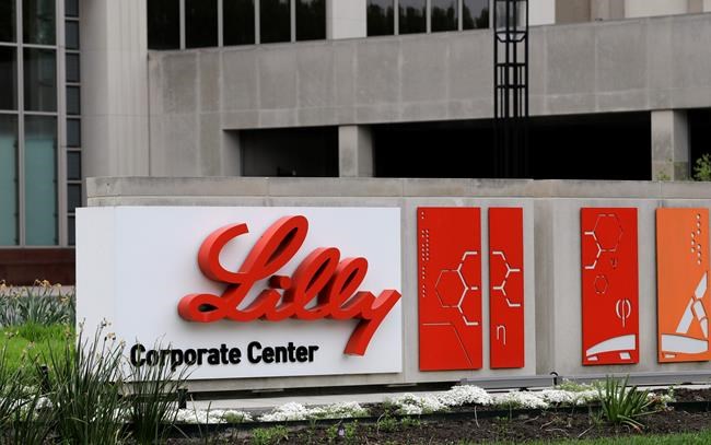 FILE - This April 26, 2017 file photo shows the Eli Lilly & Co. corporate headquarters in Indianapolis. Shares of Eli Lilly jumped after the drugmaker laid out a better-than-expected revenue forecast and plans to buy a young company developing a potential Parkinson’s disease treatment. Lilly also projected on Tuesday, Dec. 15, 2020, a 2021 earnings range that brackets average Wall Street expectations. (AP Photo/Darron Cummings)