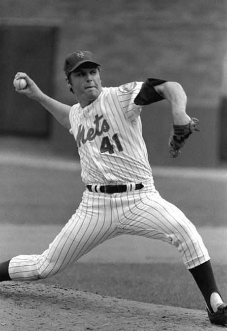 FILE - In this Aug. 14, 1974, file photo, New York Mets pitcher, Tom Seaver throws to a Los Angeles Dodgers batter at Shea Stadium in New York. Seaver, the galvanizing leader of the Miracle Mets 1969 championship team and a pitcher who personified the rise of expansion teams during an era of radical change for baseball, has died. He was 75. The Hall of Fame said Wednesday night, Sept. 2, 2020, that Seaver died Aug. 31 from complications of Lewy body dementia and COVID-19. (AP Photo/Ray Stubblebine, File)