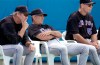 FILE - In this Feb. 25, 2002, file photo, New York Mets manager Bobby Valentine, center, coach Charlie Hough, left, and instructor Tom Robson, right, watch fom behind home plate during an intrasquad game at baseball spring training in Port St. Lucie, Fla. Former major league player and coach Robson has died. He was 75. Robson died of natural causes on Tuesday, April 20, 2021, at Memory Care Facility in Chandler, Ariz., New York Mets spokesman Jay Horwitz said Wednesday. (AP Photo/M. Spencer Green, File)