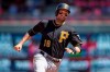 FILE - In this July 29, 2015, file photo, Pittsburgh Pirates' Neil Walker runs on the way to scoring against the Minnesota Twins during a baseball game in Minneapolis. Walker announced his retirement Tuesday, April 20, 2021, at age 35 after 12 major league seasons. Walker hit .231 with no homers and three RBIs in 18 games with Philadelphia this year. (AP Photo/Bruce Kluckhohn, File)