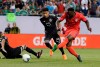 FILE - In this July 7, 2019, file photo, U.S. forward Jozy Altidore, right, shoots against Mexico midfielder Jesus Gallardo during the first half of the CONCACAF Gold Cup soccer final at Soldier Field in Chicago. Altidore is back with the U.S. national team for the first time in 1 1/2 years. The 31-year-old Toronto forward is among 12 players invited Tuesday to a training camp starting Jan. 9 in Bradenton, Fla., ahead of a contemplated exhibition against Serbia in late January at Orlando. (AP Photo/Nam Y. Huh, File)
