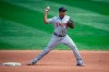 FILE - In this Sept. 4, 2020, file photo, Detroit Tigers second baseman Jonathan Schoop turns a double play against the Minnesota Twins during a baseball game in Minneapolis. Schoop is staying with the Tigers, agreeing to a one-year contract. The 29-year-old hit .278 with eight home runs in the abbreviated 2020 season. He hit at least 21 home runs each of the previous four years. (AP Photo/Bruce Kluckhohn, File)