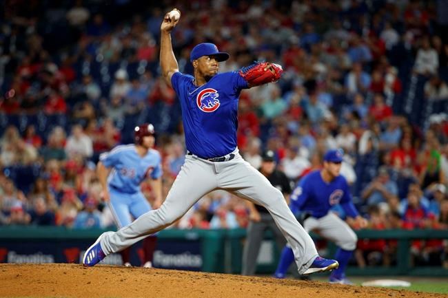 FILE - In this Aug. 15, 2019, file photo, Chicago Cubs relief pitcher Pedro Strop throws during the ninth inning of the team's baseball game against the Philadelphia Phillies in Philadelphia. The Cubs agreed to a minor league deal with Strop on Friday, Sept. 4, 2020, bringing back the popular reliever after he was released by Cincinnati. A person with direct knowledge of the contract confirmed the deal on condition of anonymity because it was pending a physical. Strop will report to the team's alternate training site in South Bend, Ind. (AP Photo/Chris Szagola, File)
