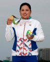 FILE - In this Aug. 20, 2016, file photo, Inbee Park, of South Korea, holds up her gold medal after the final round of women's golf at the Summer Olympics in Rio de Janeiro, Brazil. With the postponement of the Tokyo Games, Park gets more time to try to boost her world ranking and try to defend her gold medal in 2021. (AP Photo/Chris Carlson, File)