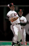 FILE - In this July 4, 1986, file photo, Steve Carlton, left, under the watchful eye of San Francisco Giants pitching coach Norm Sherry, warms up before the team's baseball game against the St. Louis Cardinals in San Francisco. Sherry, whose suggestion to Los Angeles Dodgers teammate Sandy Koufax helped cultivate the future Hall of Fame pitcher's potential, has died. He was 89. Sherry died Monday, March 8, 2021, of natural causes at an assisted living facility in San Juan Capistrano, Calif., his son Mike told The Associated Press on Wednesday. (AP Photo/Jim Gerberich, File)
