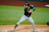 FILE - In this Aug. 24, 2020, file photo, Oakland Athletics' Robbie Grossman waits on a pitch from the Texas Rangers during a baseball game in Arlington, Texas. The Detroit Tigers have signed Grossman to a two-year, $10 million contract that includes performance bonuses. (AP Photo/Tony Gutierrez, File)